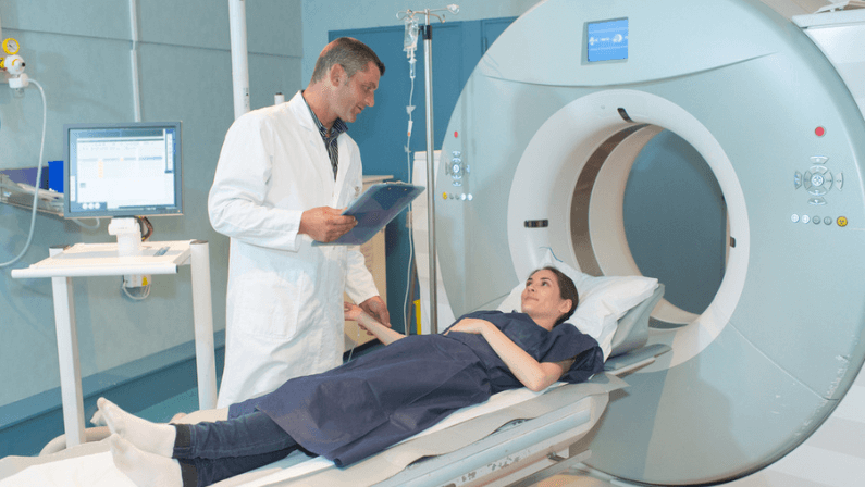 Futuristic Concept: In Medical Control Room Doctor Wearing Virtual Reality Headset Monitors Patient Undergoing MRI or CT Scan Procedure. Computer Displays Show 3D Brain Model with Possible Cancer.
Important information