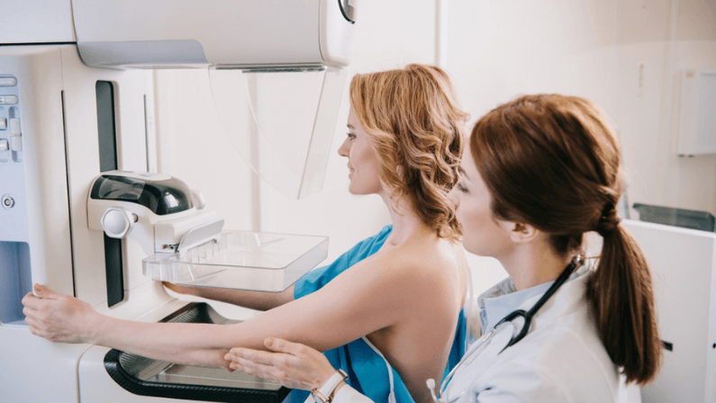 asian woman doctor Breast cancer Symptoms, risk factors, and treatment checking for patient in clinic office