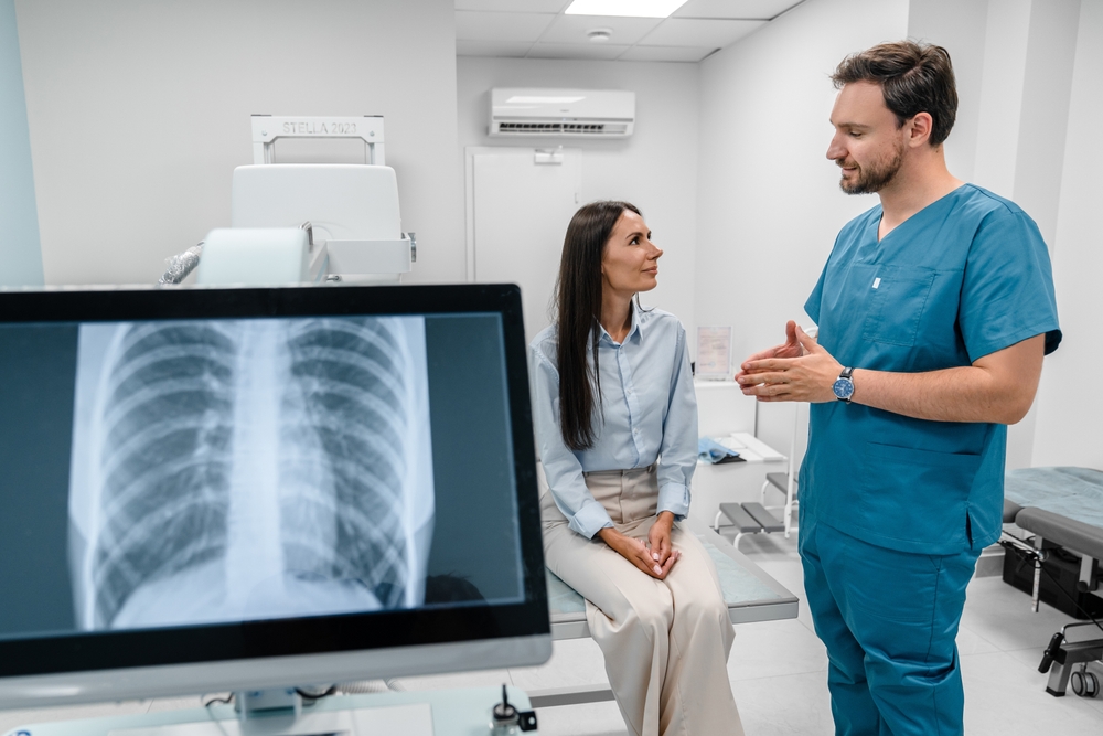 Caucasian young male medic doctor specialist radiologist in blue uniform
