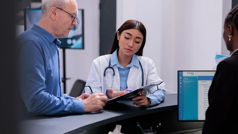 Physician showing disease diagnosis report to sick elderly patient discussing health care treatment in hospital waiting area. Medic prescribing medication to help manage the man chronic pain.