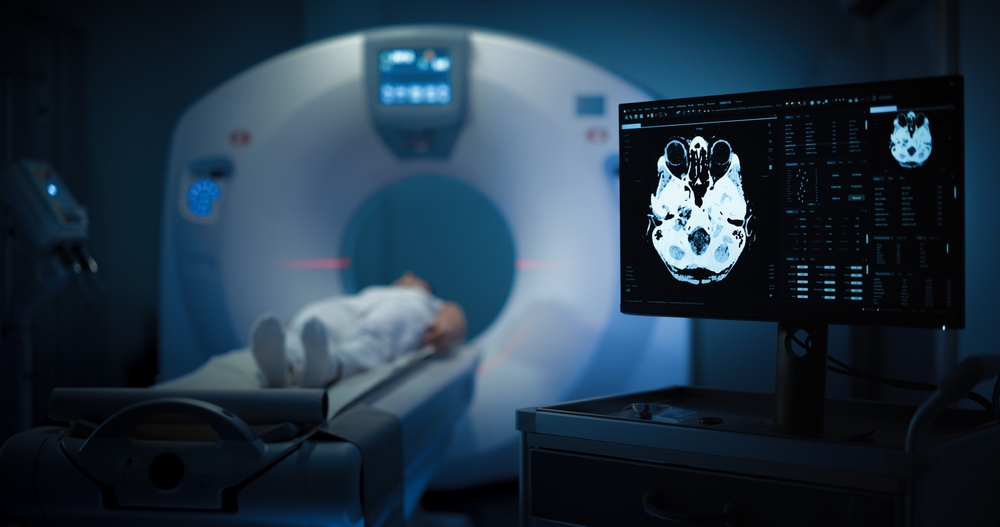 Medium Shot of a Female Patient Lying on a CT or MRI Scan