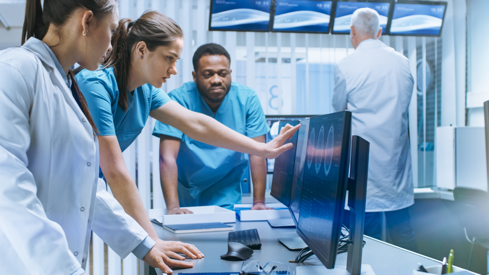 Solve Problems and Point at Computer Screens Showing CT, MRI Scans